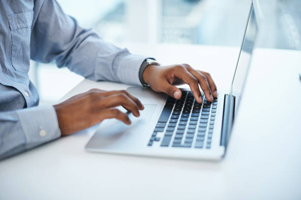 Shot of a businessman using a computer in a modern office